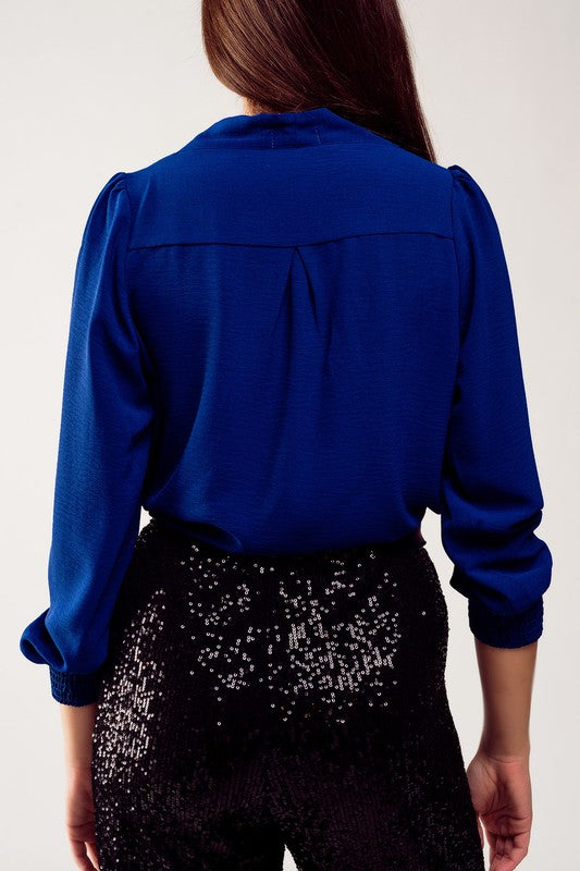 Long sleeved wrap satin blouse in blue